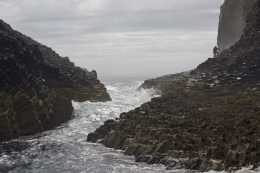 Water surging through a channel on the island of Staffa